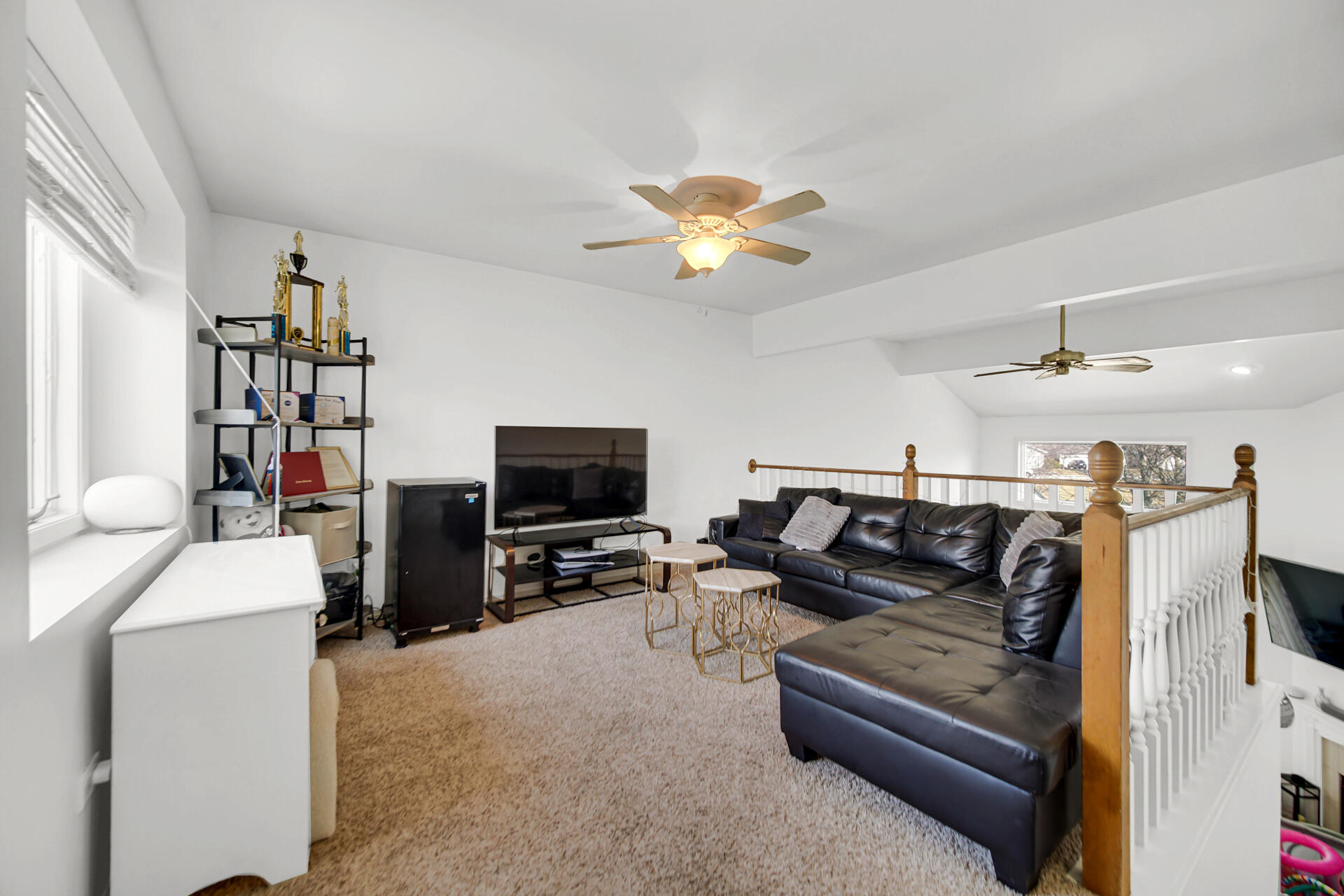 9993 Hunters Run St. John, IN 46373 - Photo 24 of 28 a living room with furniture and a flat screen tv