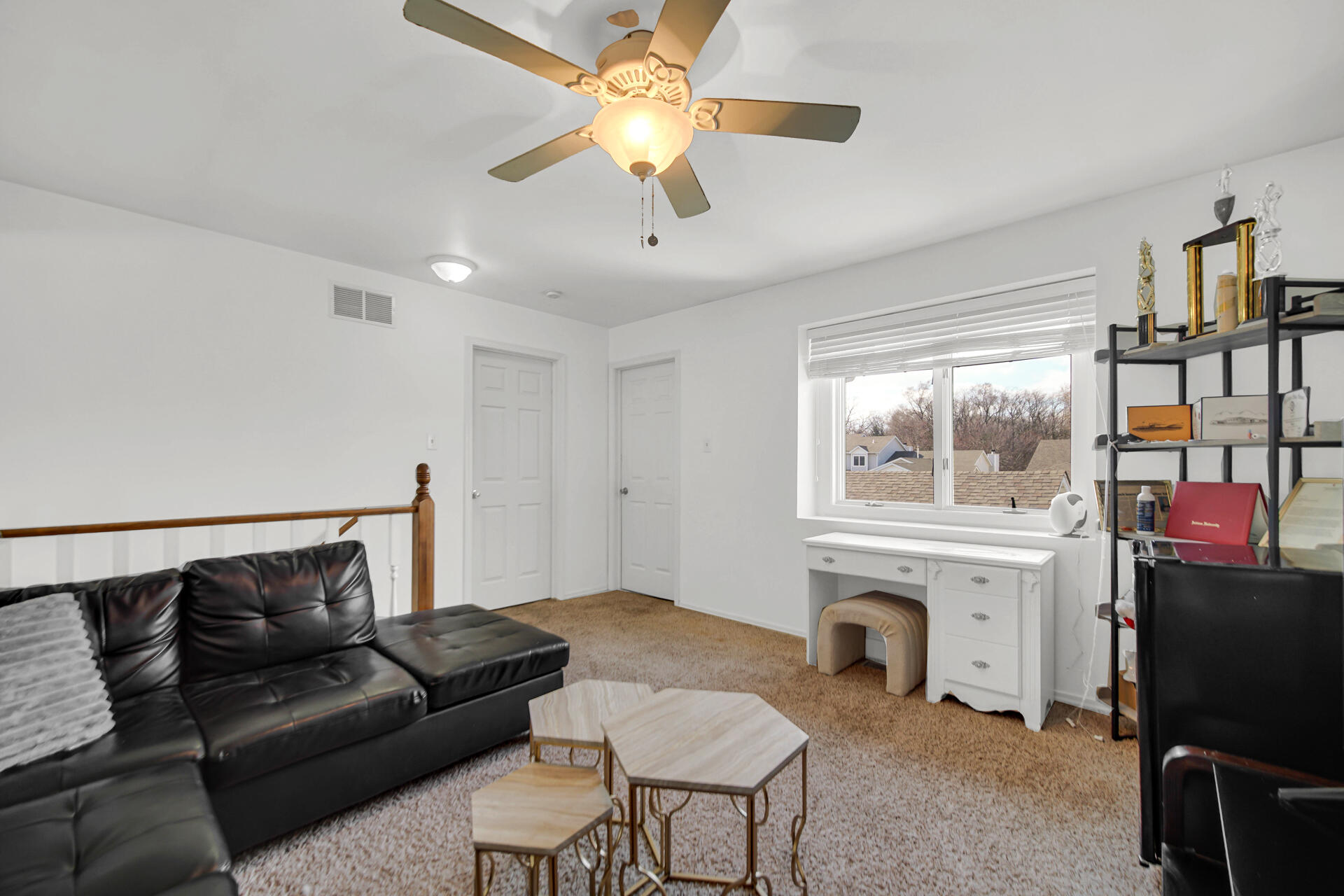 9993 Hunters Run St. John, IN 46373 - Photo 25 of 28 a living room with furniture a fireplace and a flat screen tv
