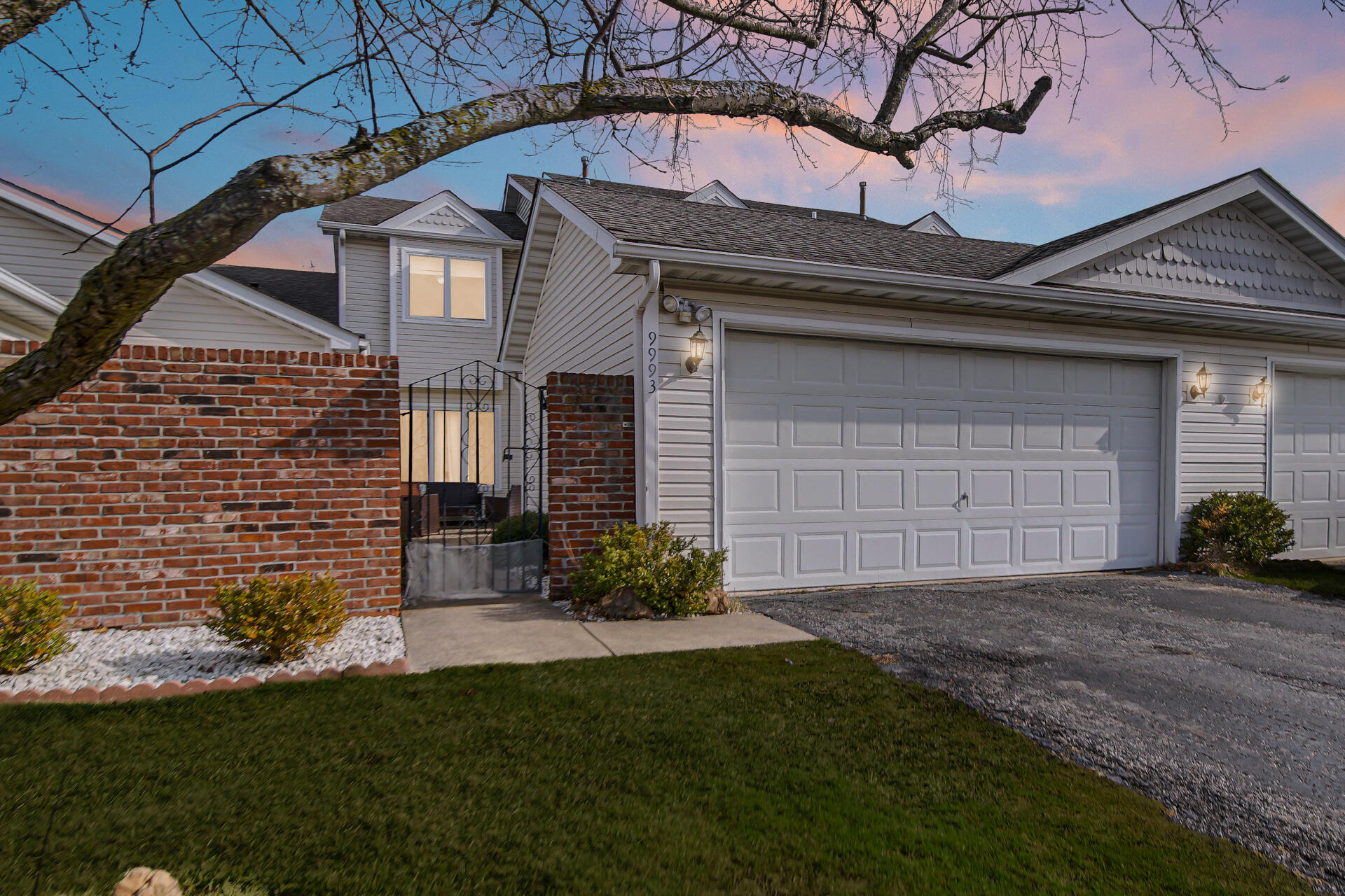 9993 Hunters Run St. John, IN 46373 - Photo 3 of 28 a front view of a house with a garden