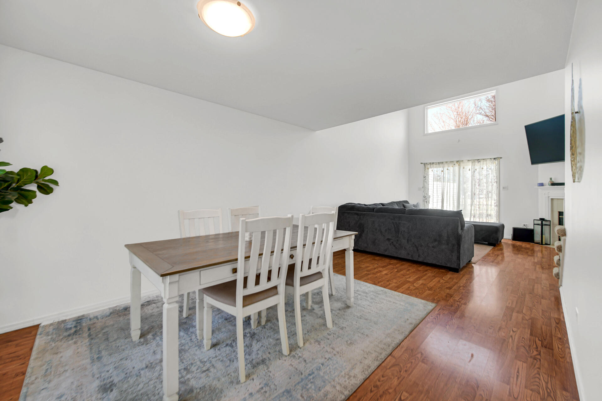 9993 Hunters Run St. John, IN 46373 - Photo 7 of 28 a view of a livingroom with furniture a flat screen tv and a window