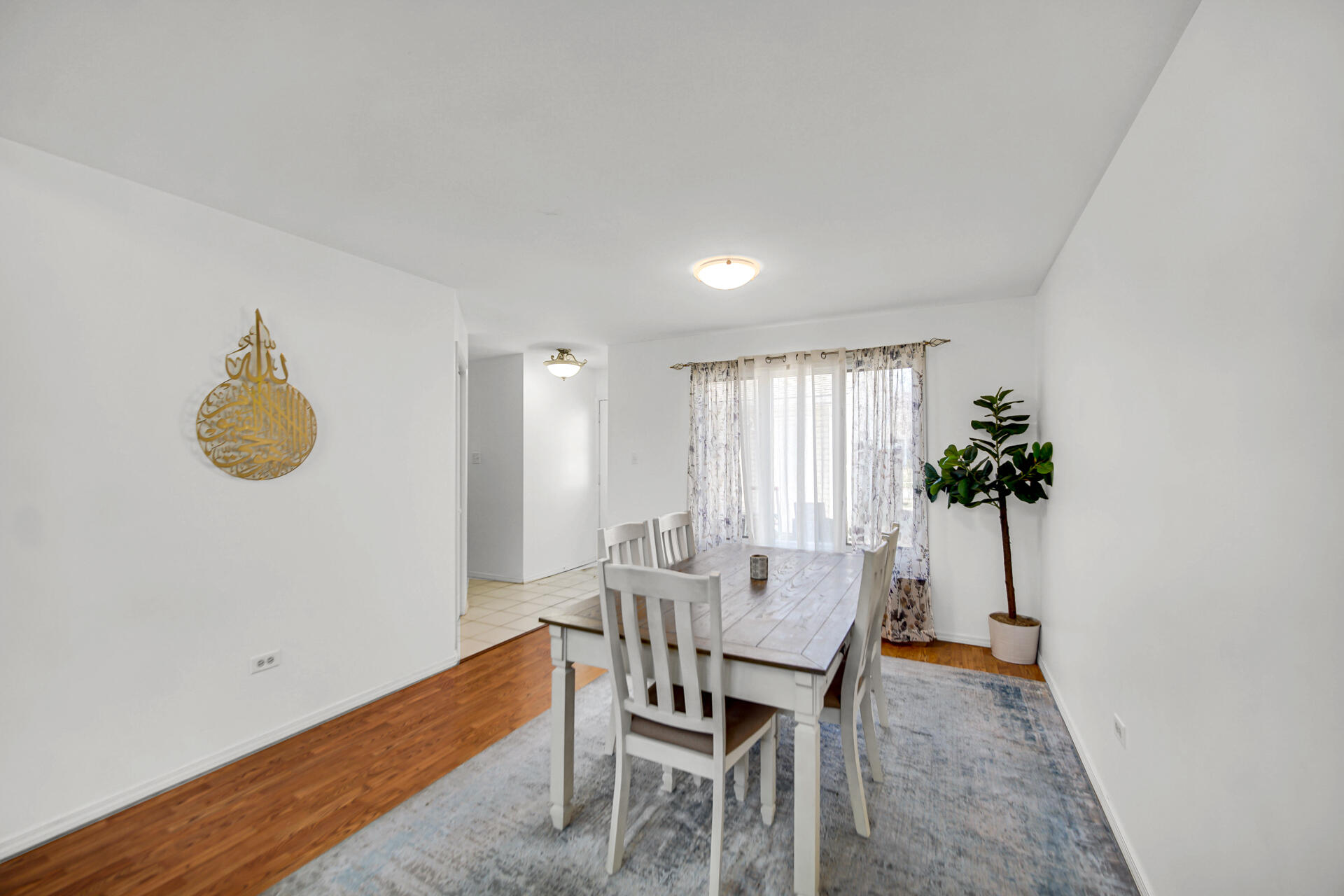 9993 Hunters Run St. John, IN 46373 - Photo 9 of 28 a view of a dining room with furniture and wooden floor
