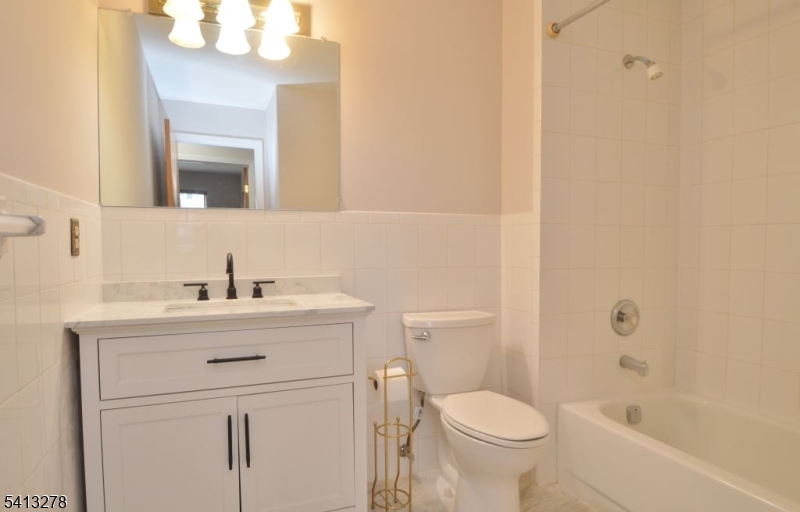 13 Gracie Road East Hanover, NJ 07936 - Photo 12 of 15 a bathroom with a sink toilet and shower
