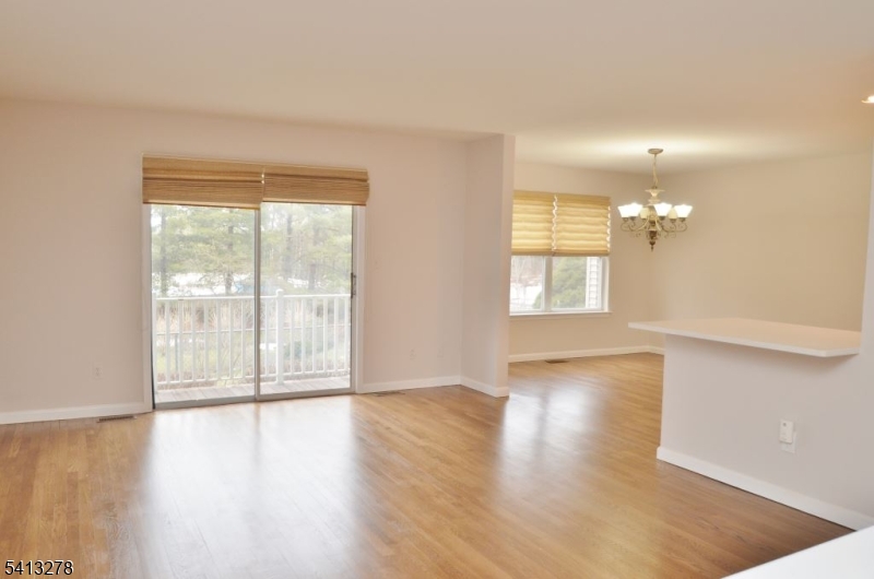 13 Gracie Road East Hanover, NJ 07936 - Photo 6 of 15 a view of an empty room with wooden floor and a window