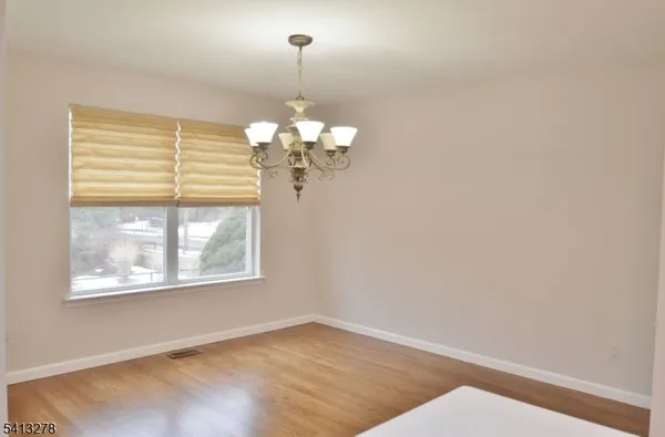 a view of a windows and chandelier in a room