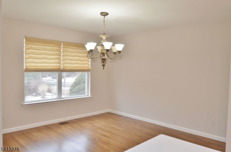 13 Gracie Road East Hanover, NJ 07936 - Photo 7 of 15 a view of a windows and chandelier in a room