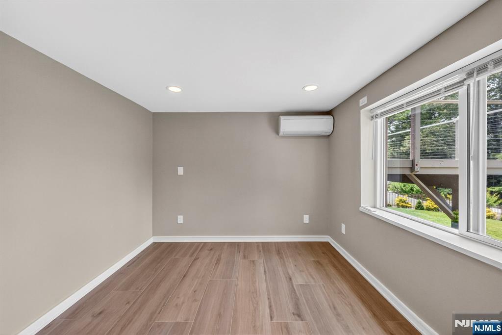 57 Hemlock Road Little Falls, NJ 07424 - Photo 30 of 50 wooden floor in an empty room with a window