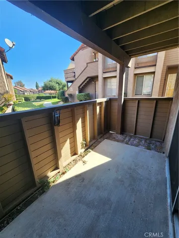a kitchen with sink attached with living room