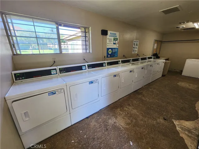 a view of swimming pool with lounge chair
