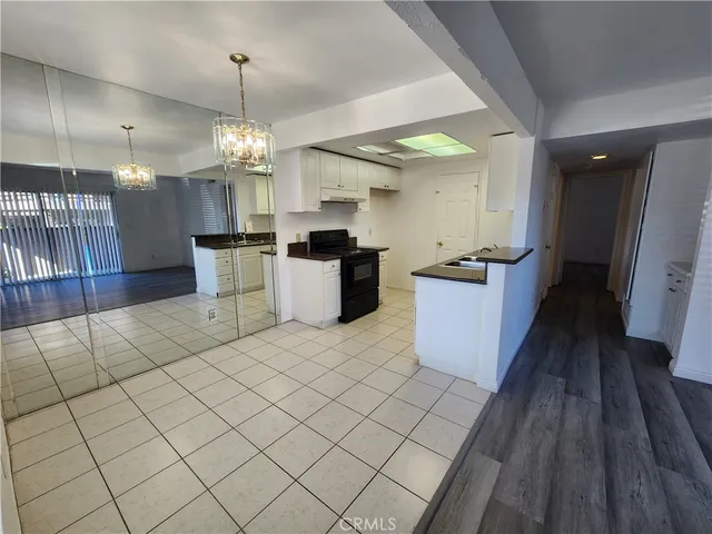 a view of a livingroom with wooden floor