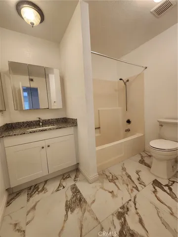 a view of an empty room and wooden floor