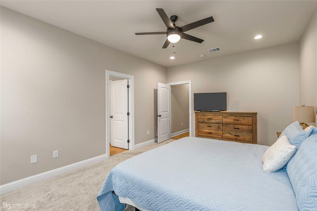 122 Brimestone Loop Benton, LA 71006 - Photo 16 of 33 a bedroom with a bed and a ceiling fan