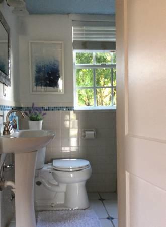 382 Ellamar Road West Palm Beach, FL 33405 - Photo 26 of 39 a bathroom with a toilet a sink and a mirror