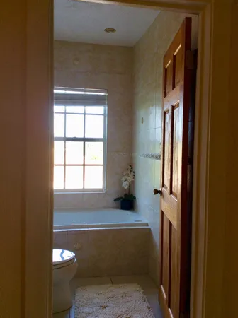 a bathroom with a sink a toilet and tub