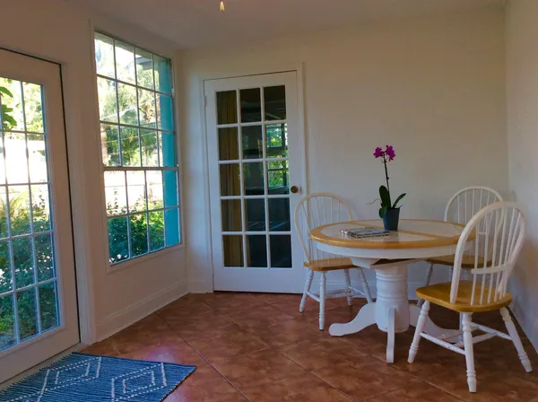 a view of a dining room with furniture and window
