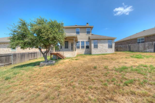 321 Limestone Trail Austin, TX 78737 - Photo 28 of 28 a front view of a house with a yard