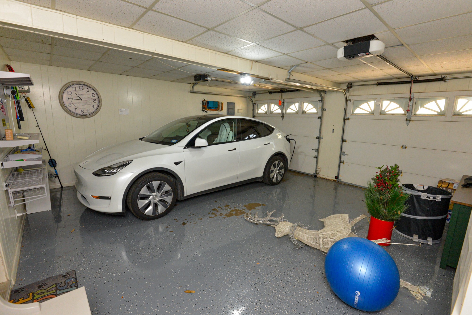 10710 D-K Ranch Road Austin, TX 78759 - Photo 32 of 34 Ample garage space for parking, featuring bright overhead lighting and easy access.