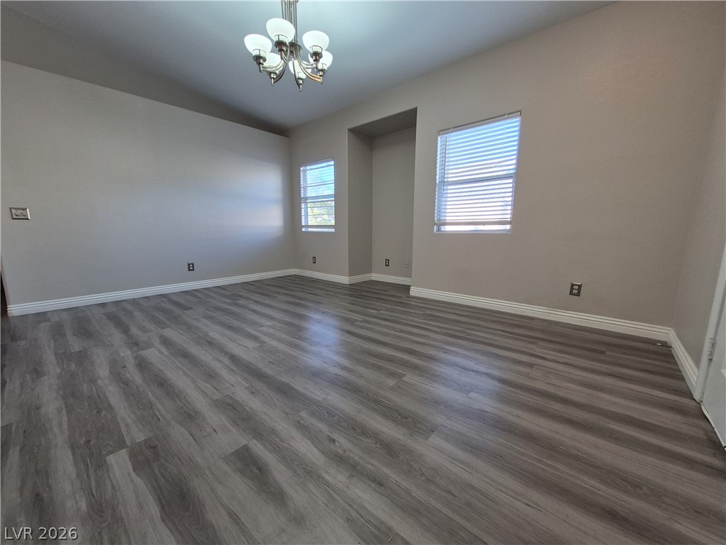 2053 Quarry Ridge Street, Unit 201 Las Vegas, NV 89117 - Photo 1 of 21 A well-proportioned room with wood flooring and natural light, ready for your personal touch.