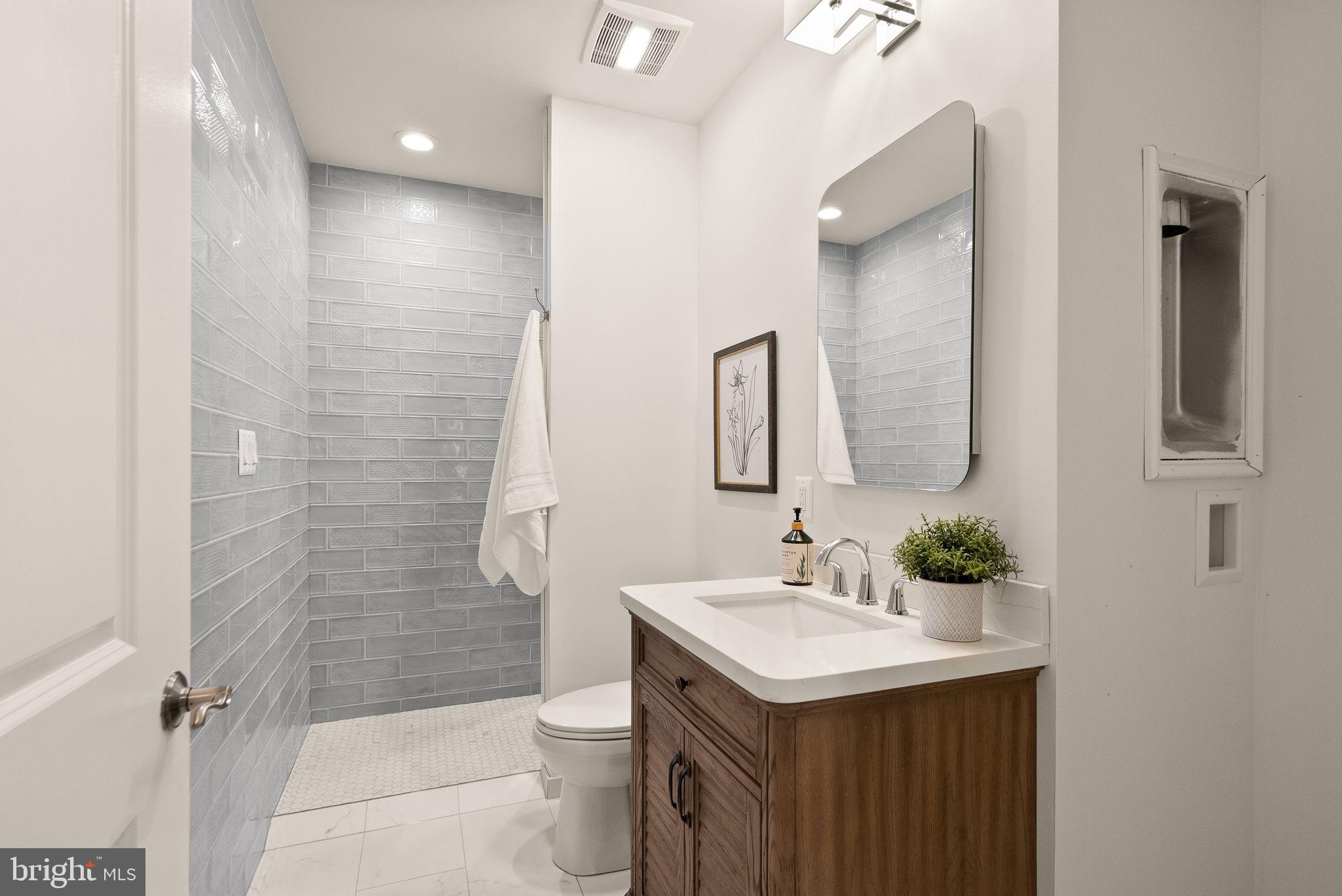 24974 First Harvest Court Aldie, VA 20105 - Photo 105 of 143 a bathroom with a granite countertop sink toilet and shower