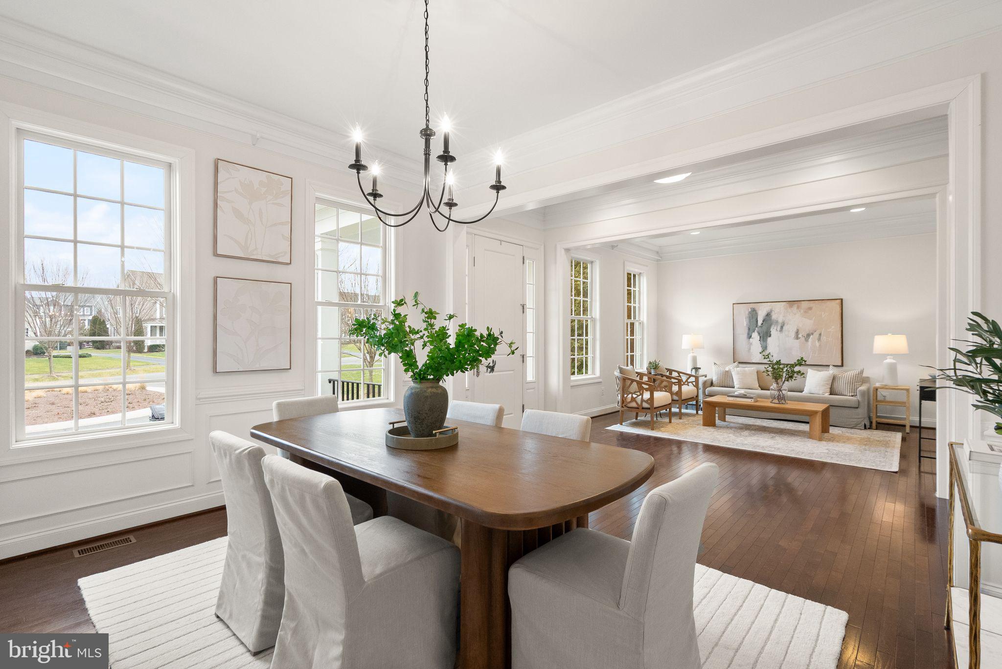 24974 First Harvest Court Aldie, VA 20105 - Photo 20 of 143 a view of a dining room with furniture window and wooden floor