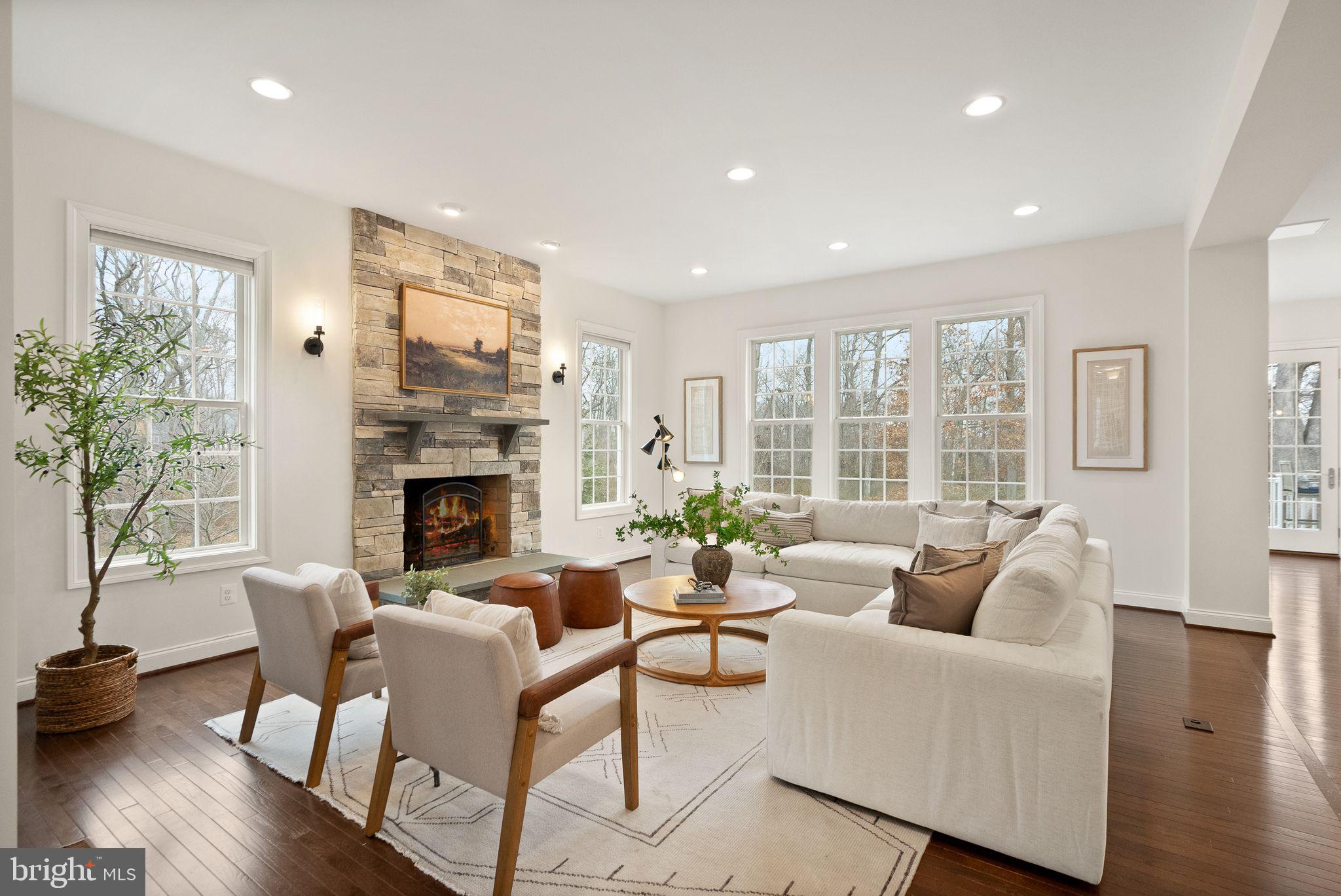 24974 First Harvest Court Aldie, VA 20105 - Photo 21 of 143 a living room with furniture fireplace and a large window
