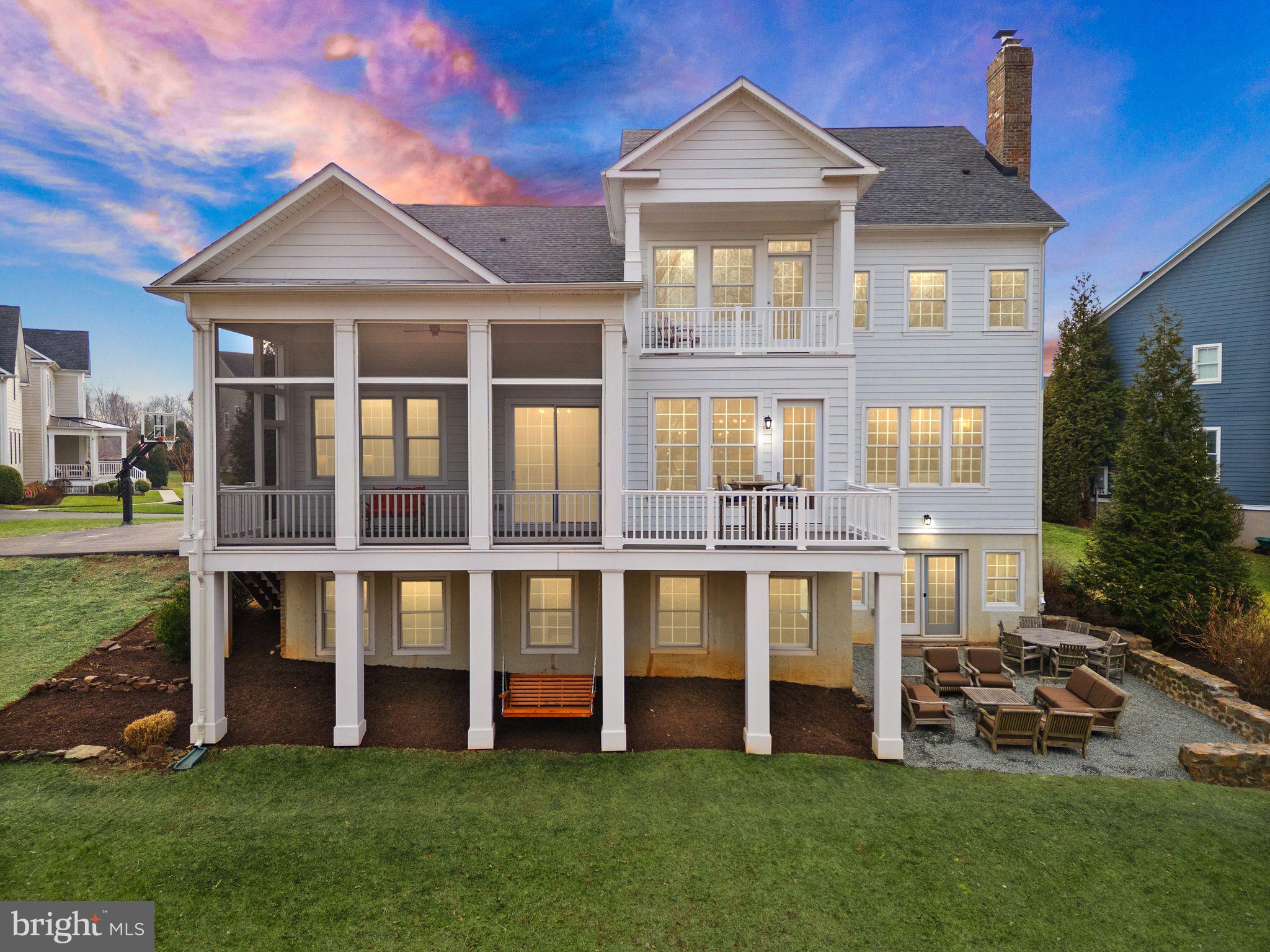 24974 First Harvest Court Aldie, VA 20105 - Photo 3 of 143 a front view of a house with a yard