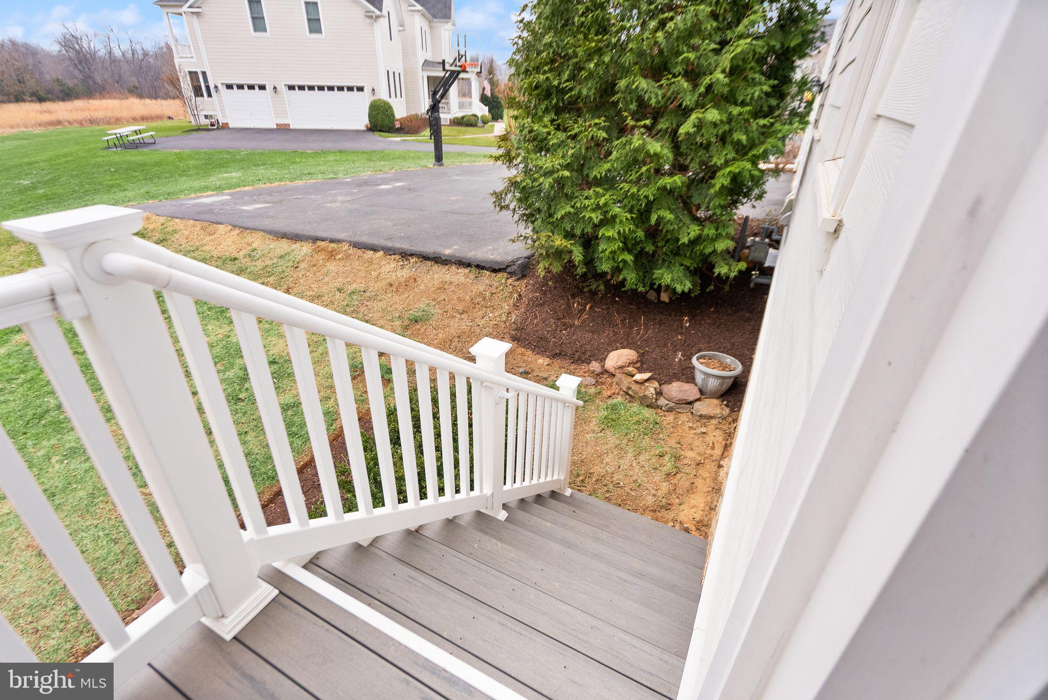 24974 First Harvest Court Aldie, VA 20105 - Photo 46 of 143 a view of backyard with wooden fence