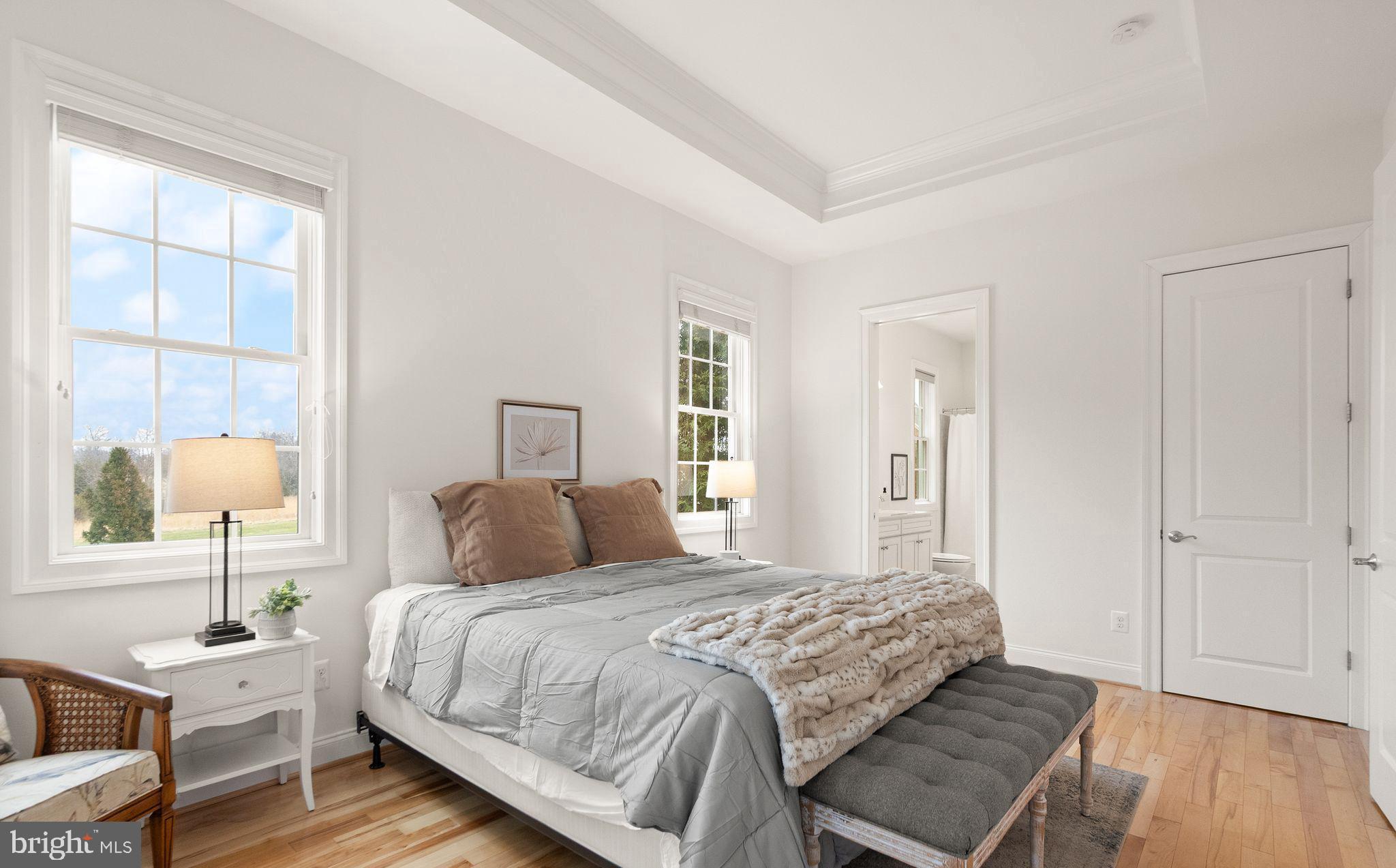 24974 First Harvest Court Aldie, VA 20105 - Photo 48 of 143 a bedroom with a bed and wooden floor