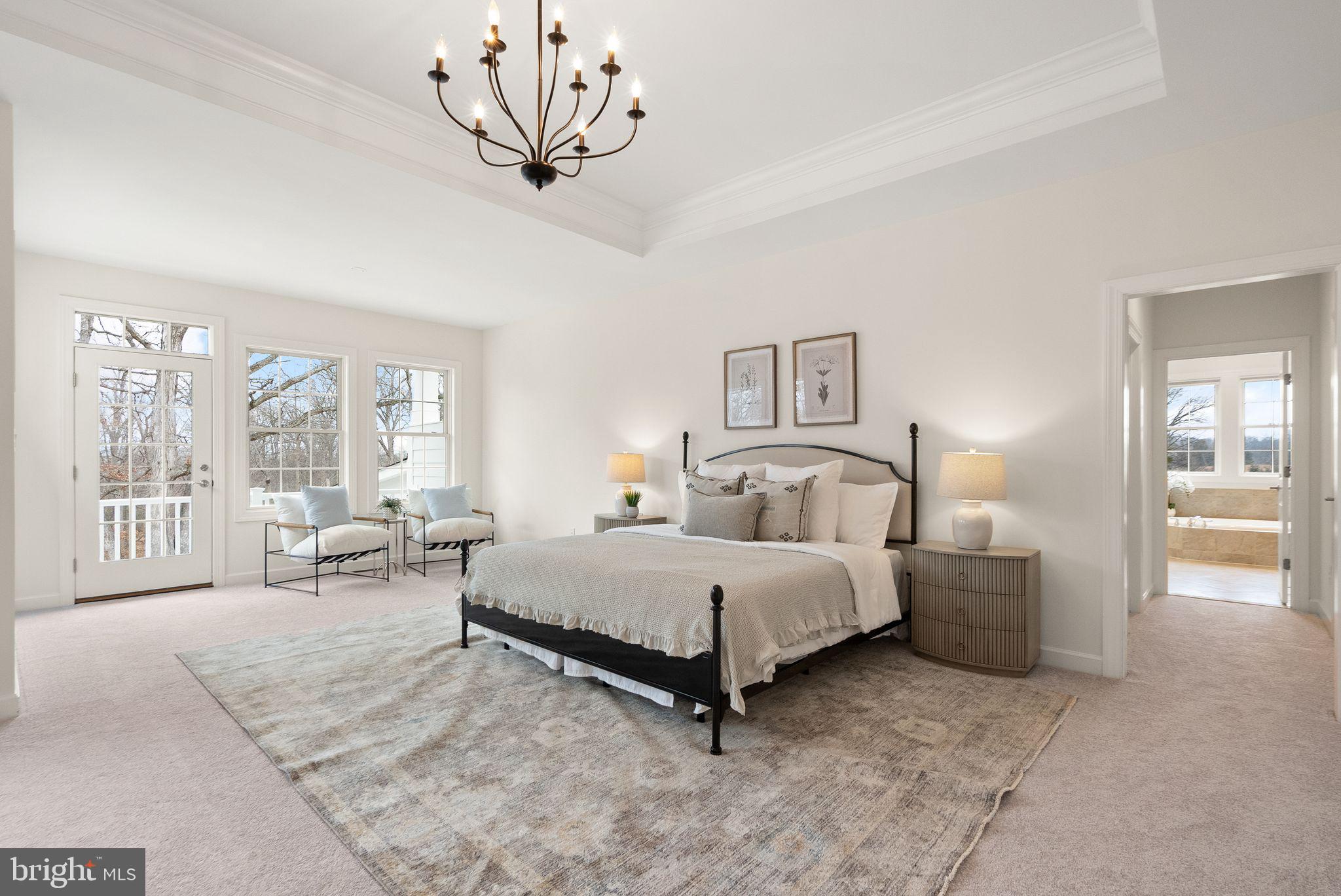 24974 First Harvest Court Aldie, VA 20105 - Photo 58 of 143 a spacious bedroom with a bed a large window with table and chair