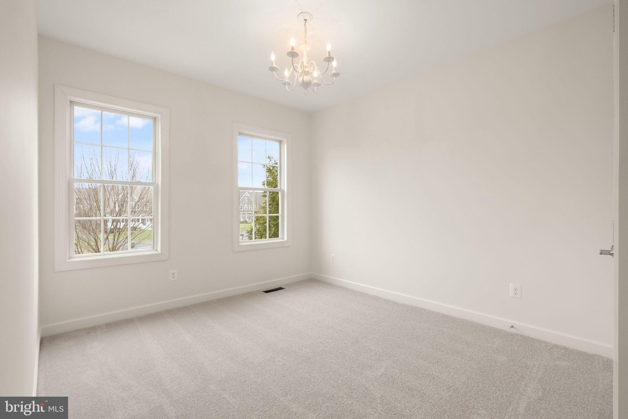 24974 First Harvest Court Aldie, VA 20105 - Photo 75 of 143 an empty room with windows and entrance