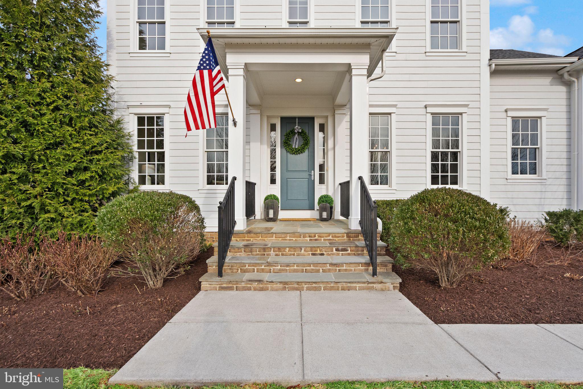 24974 First Harvest Court Aldie, VA 20105 - Photo 10 of 143 a view of a house with potted plants
