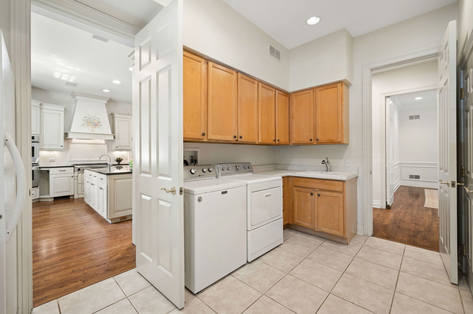 228 Old Green Bay Road Glencoe, IL 60093 - Photo 16 of 40 a kitchen with white cabinets and appliances