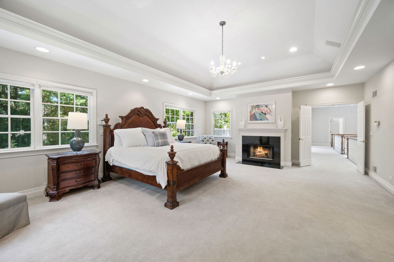 228 Old Green Bay Road Glencoe, IL 60093 - Photo 20 of 40 a spacious bedroom with a bed couch and a fireplace