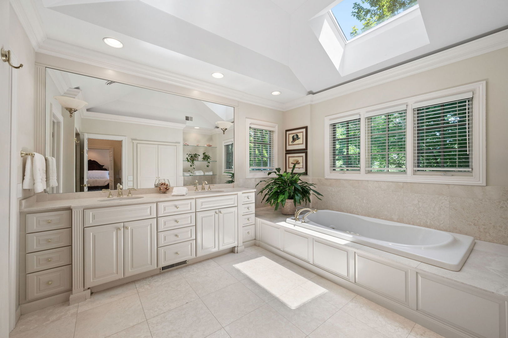 228 Old Green Bay Road Glencoe, IL 60093 - Photo 21 of 40 a spacious bathroom with a granite countertop tub and a sink