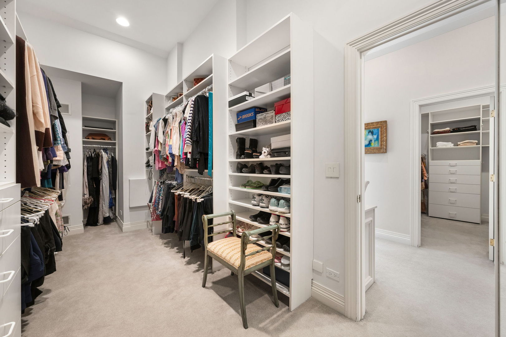 228 Old Green Bay Road Glencoe, IL 60093 - Photo 23 of 40 a view of walk in closet with clothes and shoes