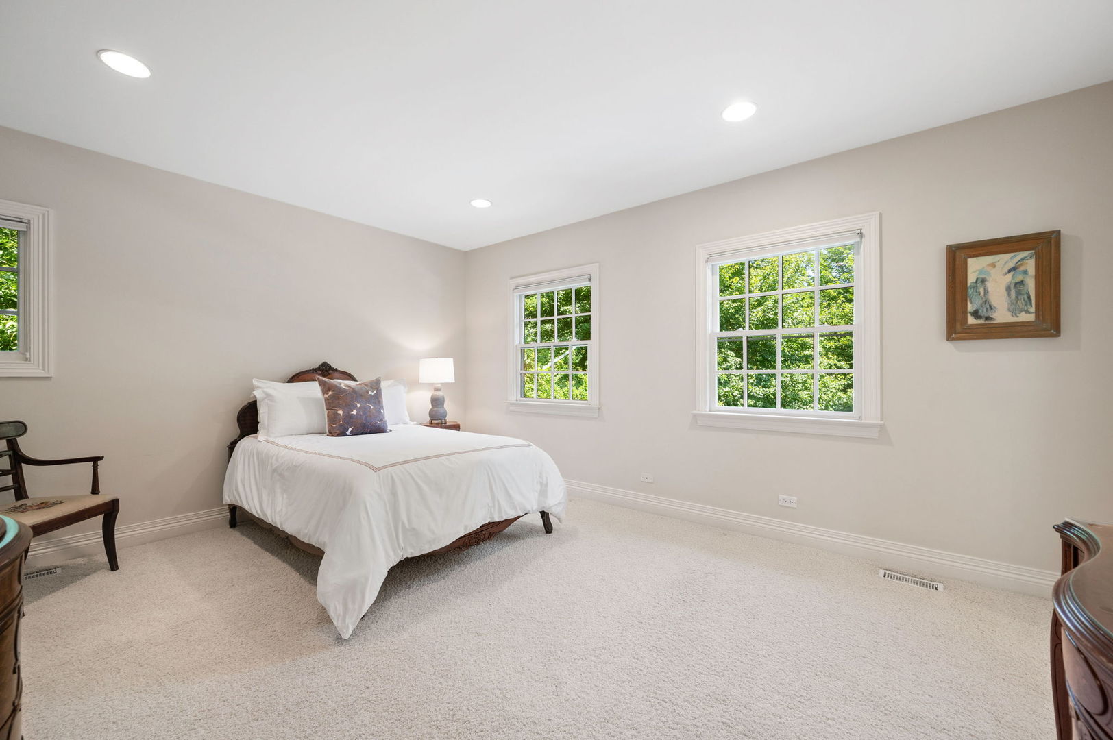 228 Old Green Bay Road Glencoe, IL 60093 - Photo 24 of 40 a spacious bedroom with a bed and a window