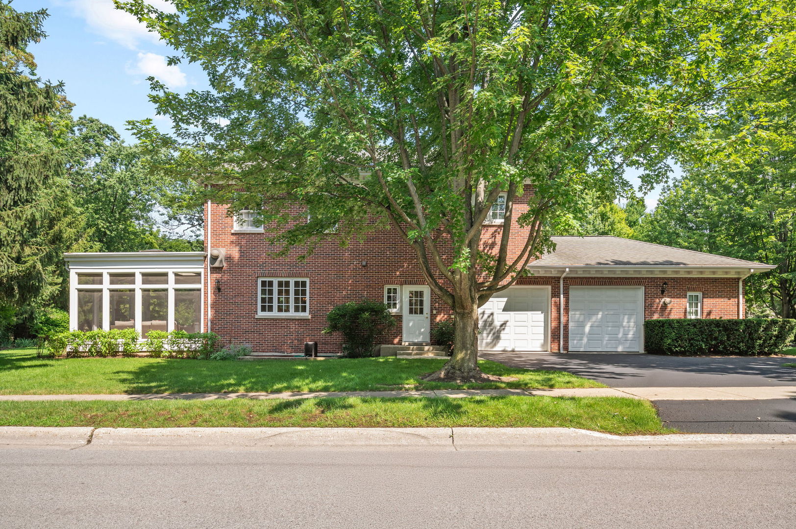 228 Old Green Bay Road Glencoe, IL 60093 - Photo 33 of 40 a front view of a house with a garden