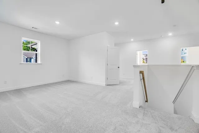 a view of a hallway with staircase