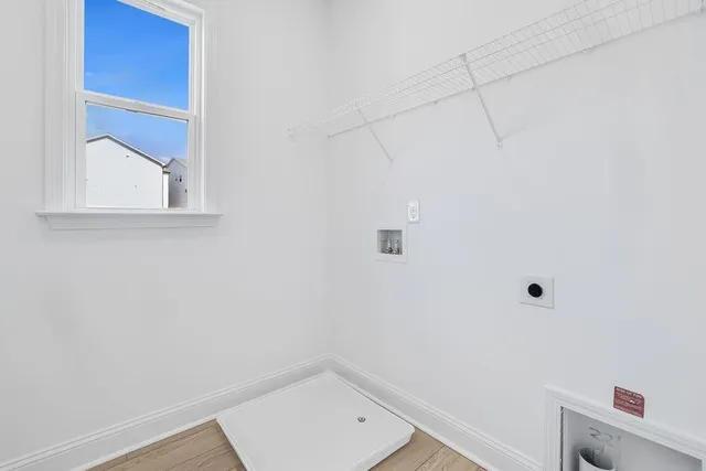 a balcony with wooden floor and fence