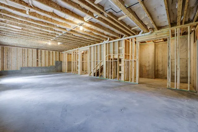 a view of a room with wooden walls