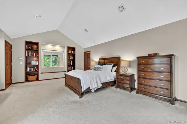 a view of a wooden deck with a yard