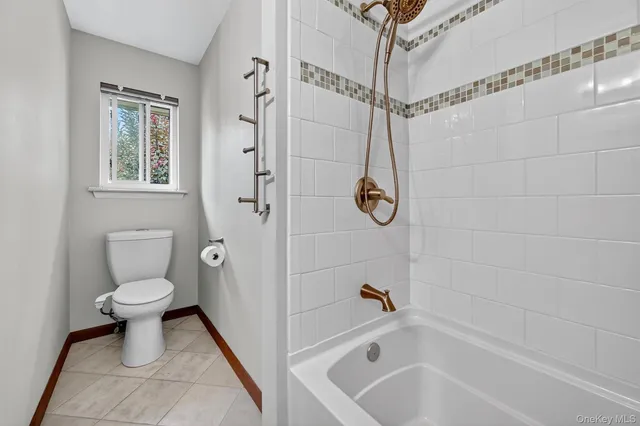 front view of a house with a large window