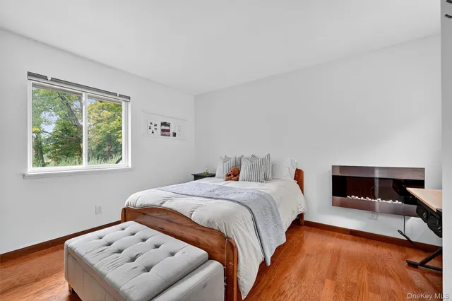 a view of house with backyard and sitting area