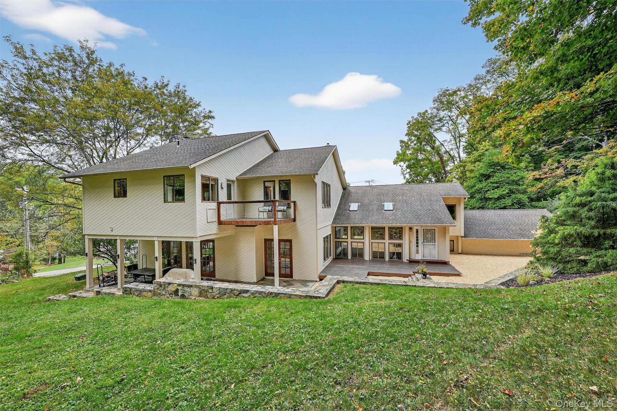 2 Tenny Lane Cornwall, NY 12518 - Photo 35 of 44 Rear view of house featuring a patio, roof with shingles, and a lawn