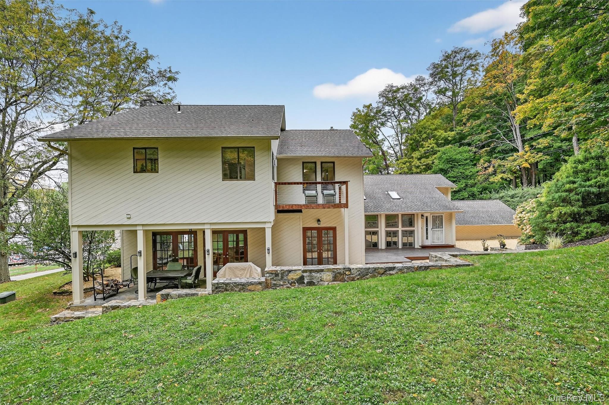 2 Tenny Lane Cornwall, NY 12518 - Photo 36 of 44 Back of house featuring a patio, a balcony, french doors, a lawn, and a shingled roof