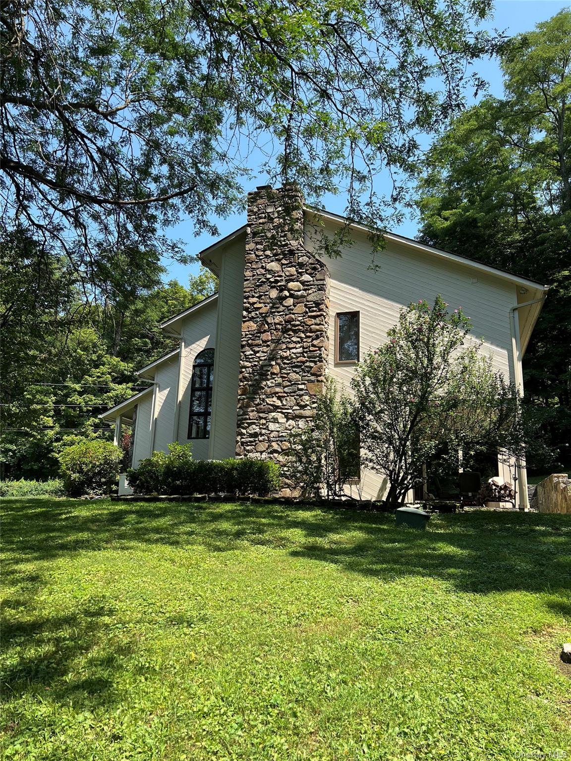 2 Tenny Lane Cornwall, NY 12518 - Photo 40 of 44 View of side of home with a yard and a stone chimney