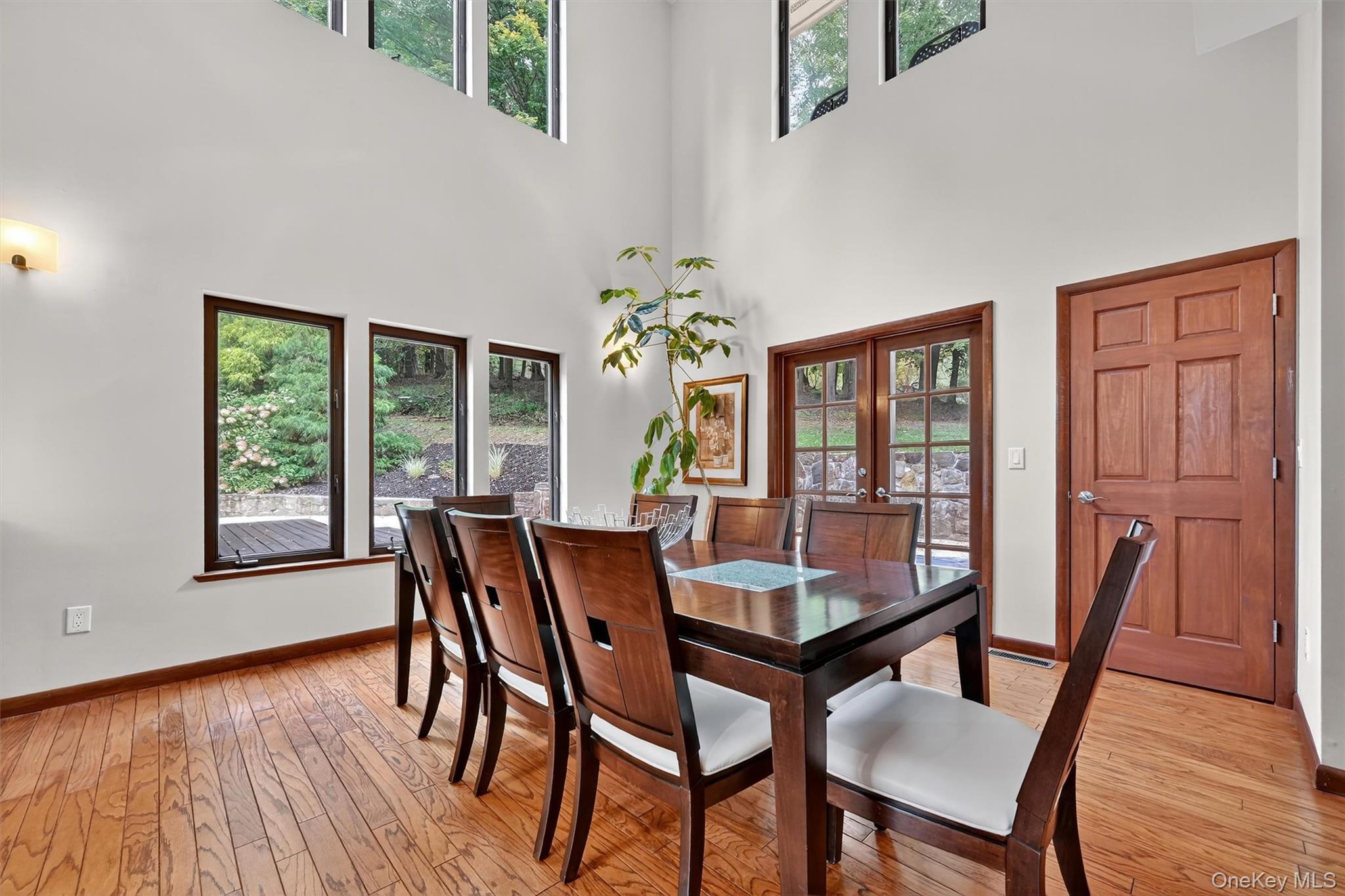 2 Tenny Lane Cornwall, NY 12518 - Photo 6 of 44 Dining area with light wood finished floors, french doors, and a towering ceiling