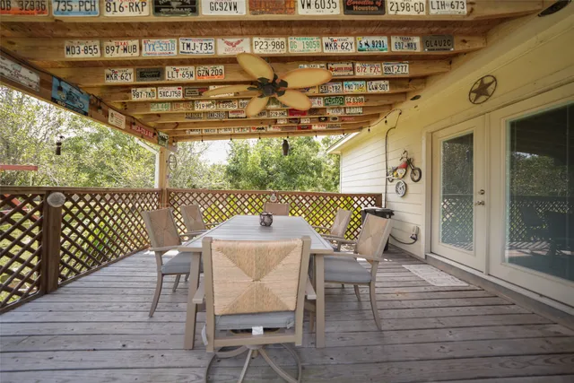 a view of a chairs and table on the deck