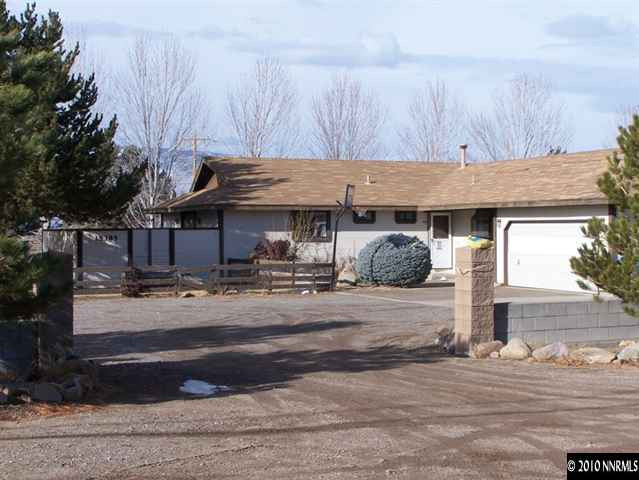 15385 Bonanza Lane Reno, NV 89521 - Photo 1 of 4 a front view of a house with garden