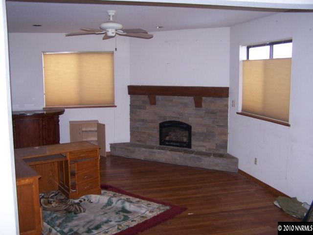 15385 Bonanza Lane Reno, NV 89521 - Photo 3 of 4 a living room with furniture and a fireplace