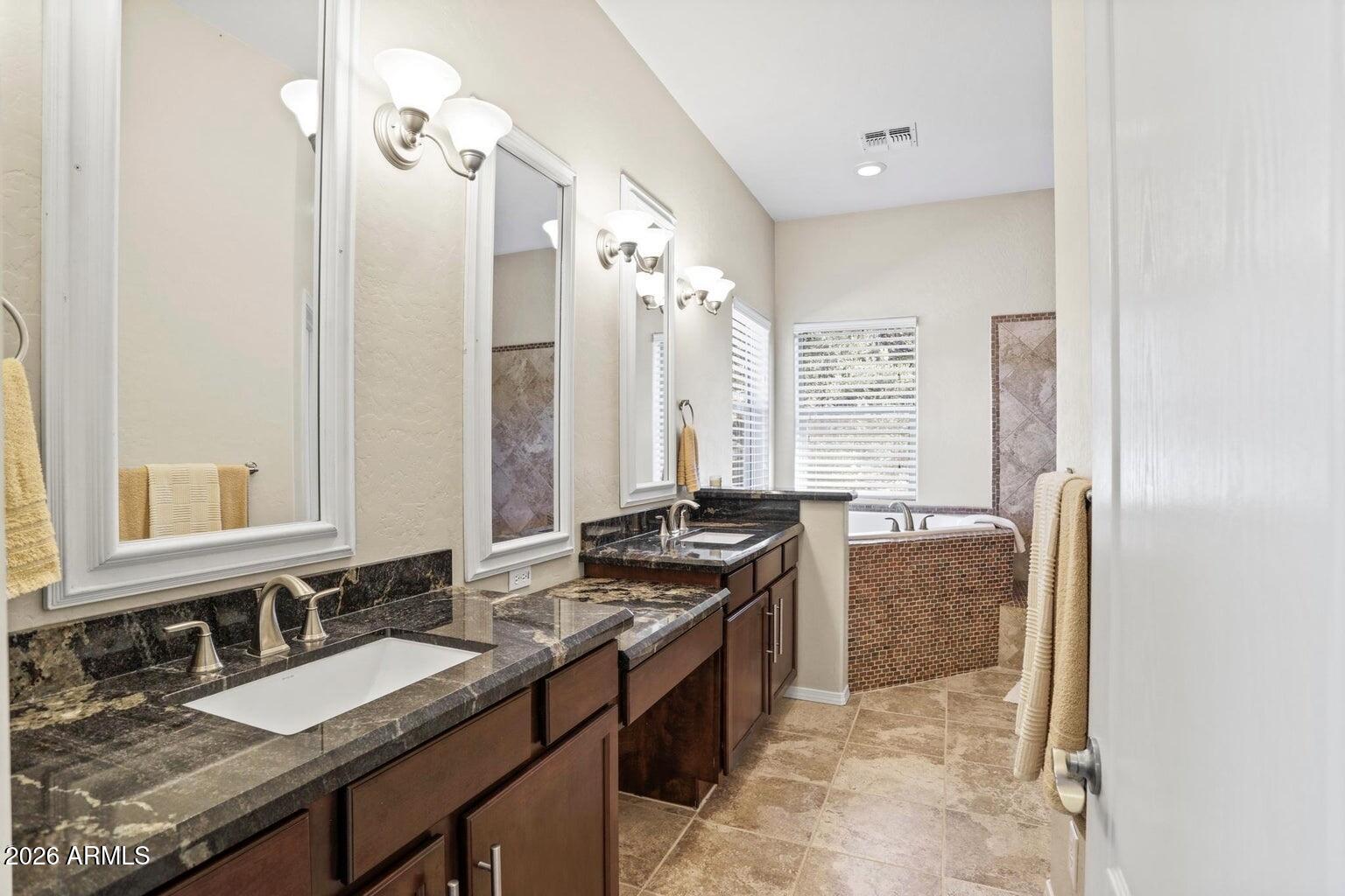 415 East Rim Estates Trail Payson, AZ 85541 - Photo 22 of 76 a bathroom with a granite countertop sink and a mirror